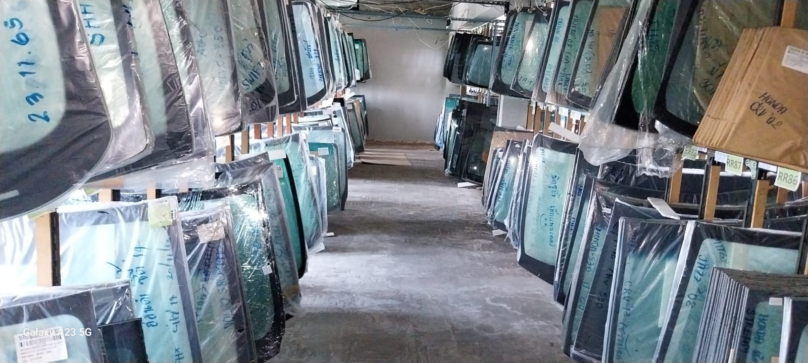 Stock of auto glass in a warehouse.